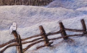 Needle felted landscape, snowy owl on fence.